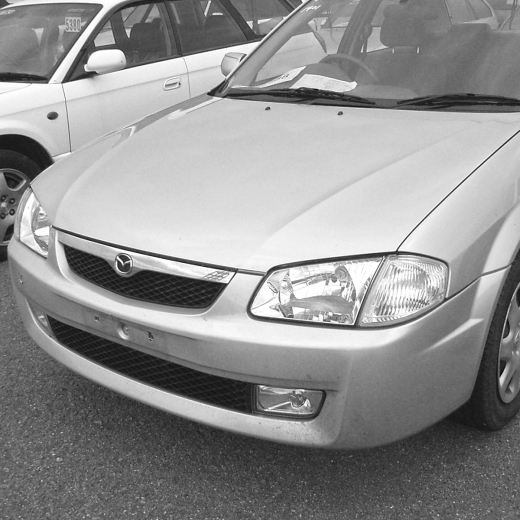 Бампер передний Mazda Familia '98-'00 контрактный