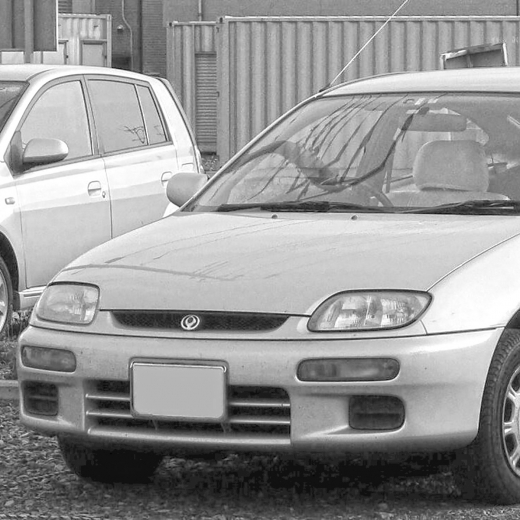 Бампер передний Mazda Familia 2wd '94-'96  контрактный 